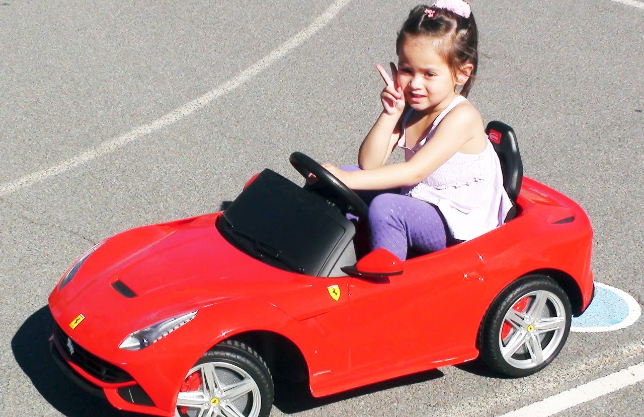 child riding car